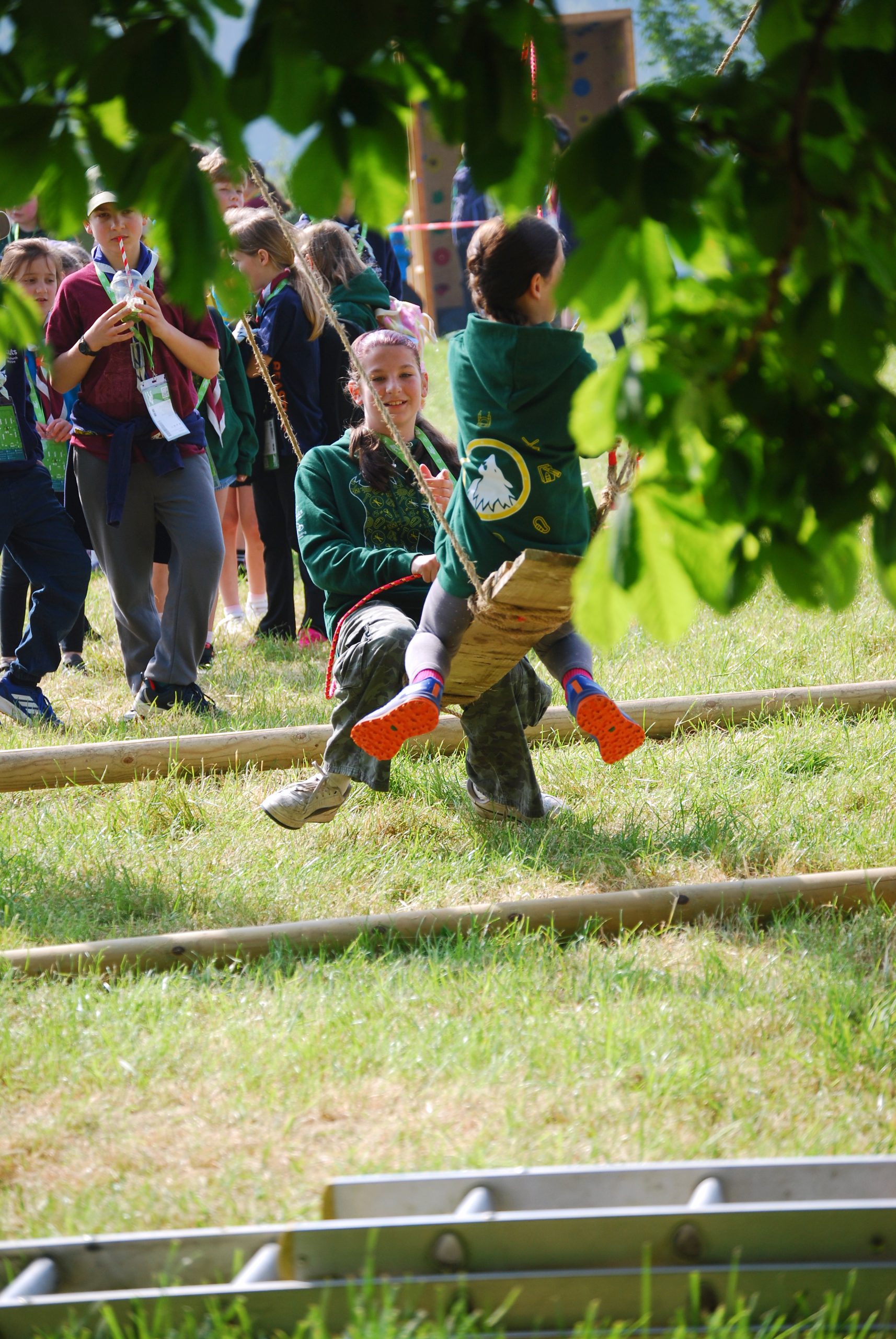 Young people enjoying an outdoor swing at BEASTLY